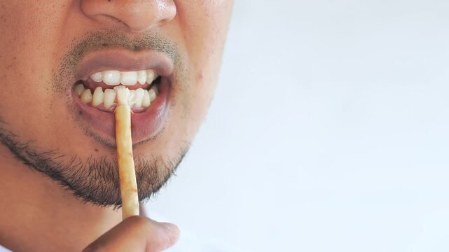 Man using miswak for traditional oral hygiene