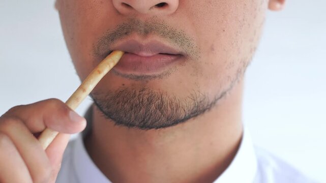 Man using miswak for traditional oral hygiene