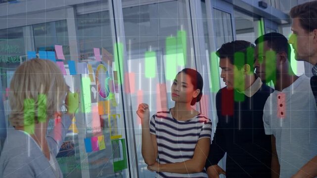 Presenter gesturing to sticky notes, team clustering and choosing priority with green-red bars