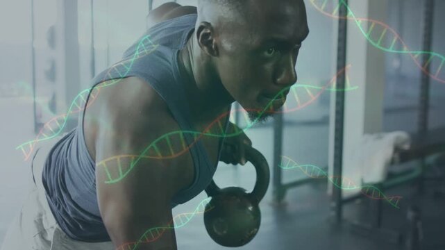 Man holding plank in gym, shifting left, rowing kettlebell for strength while DNA helix moving over