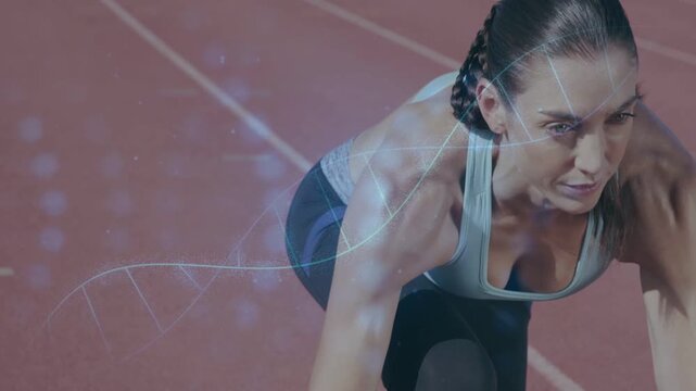 Female sprinter in crouch tensing, shifting on track while helix overlaying torso preparing start