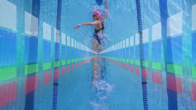Woman swimmer starting lap in sports pool, with animated overlay tracking stroke and wake for form