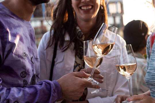 Three Friends Drinking Rose Wine Outside