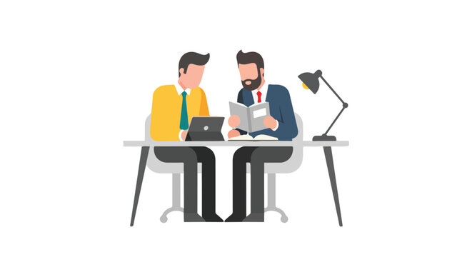 Two professional men sit at a desk collaborating, with one using a tablet and the other reviewing a manual under the light of a desk lamp.
