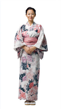 A woman in a beautiful floral kimono, standing gracefully with a serene expression against a white isolated background.