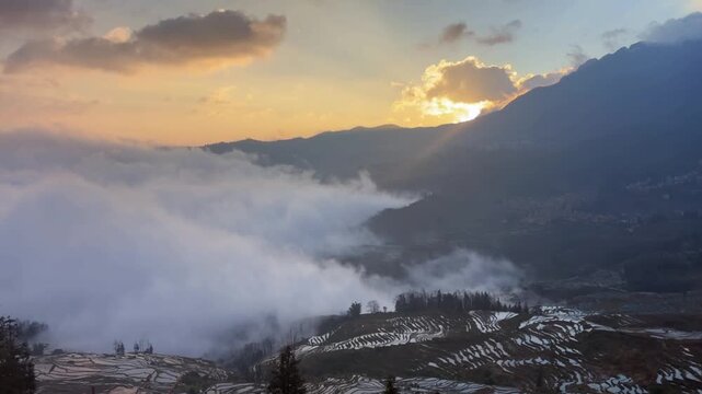 Cinematic sunrise timelapse at Yuanyang Rice Terraces with a flowing sea of clouds in Yunnan, China.