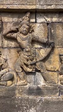 Ancient Stone Reliefs and Buddha Statues at Borobudur Temple Indonesia