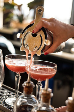 Bartender Pouring Two Pink Cocktails Cosmos 