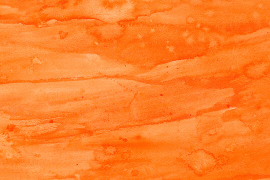 orange painted watercolor background on paper texture