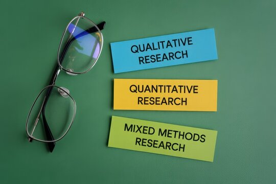 Conceptual research methods concept with spectacles and colored paper