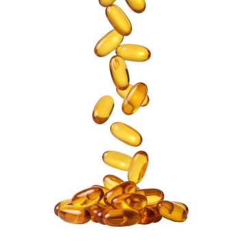 Amber gold vitamin d softgel capsules cascading in a fluid motion against a transparent background with bright warm studio lighting health and wellness atmosphere