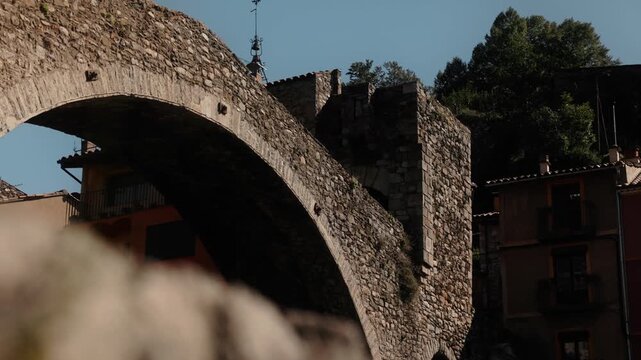 Close view of stone bridge arch in Camprodon showing detailed texture and historic architecture.