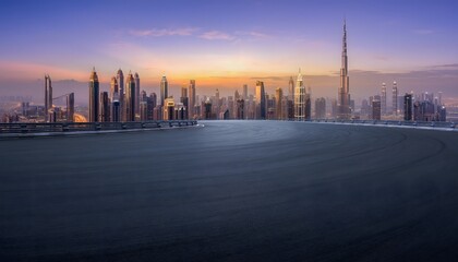 Obraz premium Modern Dubai Skyline Glowing at Sunset Behind Empty Curved Rooftop Road