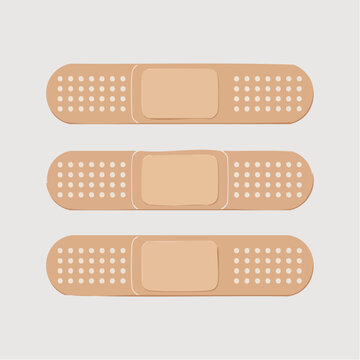 Three beige band aids with white perforated dots on a plain background
