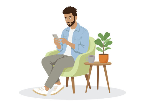 Man Using Smartphone While Sitting on Chair at Home.