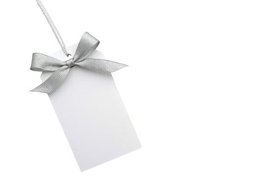 White blank tag with silver ribbon bow and string hanging on transparent background, copy space for text