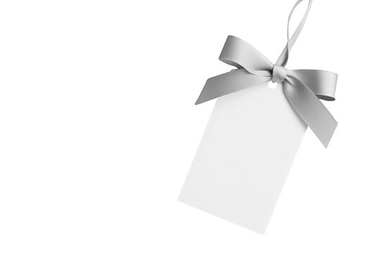 White blank paper gift tag with silver ribbon bow, hanging on transparent background, for discount and sale concepts