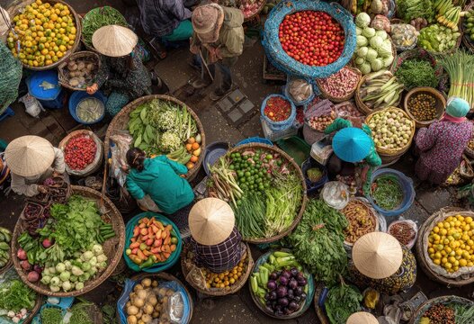 A vibrant aerial view showcases a bustling Vietnamese market filled with colorful produce and vendors.