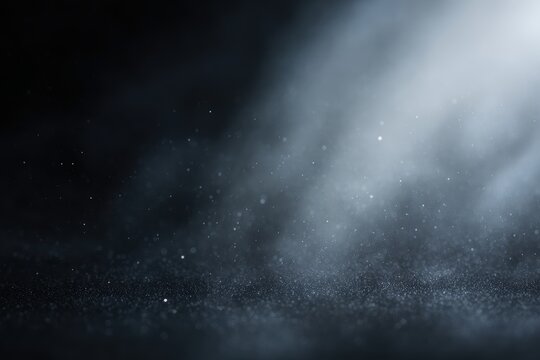 black matte textured background with floating dust particles and soft top right light dramatic abstract backdrop