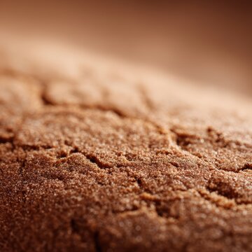Macro gingerbread texture background, detailed baked surface with warm brown tones, festive food backdrop