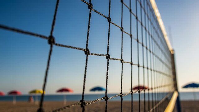 beach net close-up with sea and colorful umbrellas on sunny day