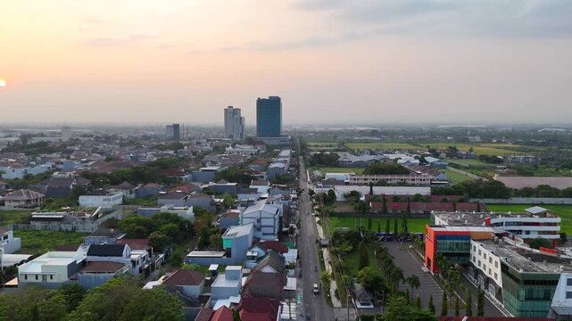 Golden sunrise over Solo Baru skyline, Central Java, Indonesia.

