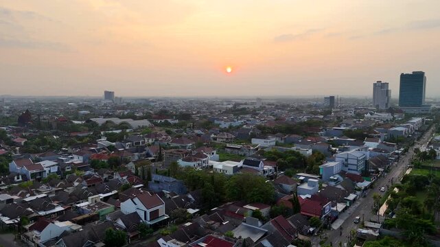 Golden sunrise over Solo Baru skyline, Central Java, Indonesia.
