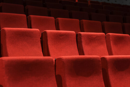 Red empty seats in the theater auditorium