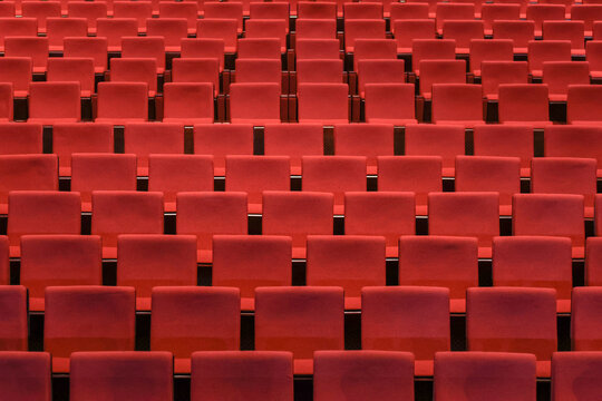 Red empty seats in the theater auditorium