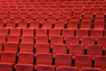 Fototapeta premium Red empty seats in the theater auditorium