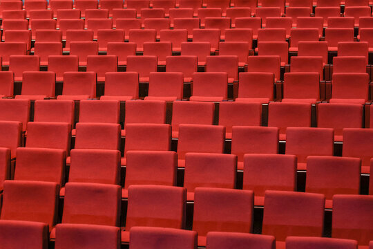 Red empty seats in the theater auditorium