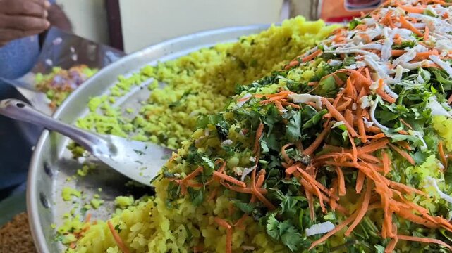 Traditional indian street food poha garnish with carrots and cilantro