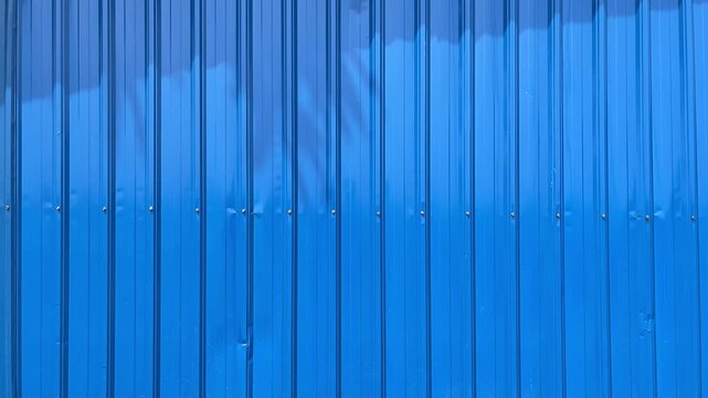 Metal sheet, zink, zinc roof, iron, fence, texture, facade line, wall, warehouse, corrugated, blue, steel, background, copy space, empty, free, negative, text, design. Side view, front
