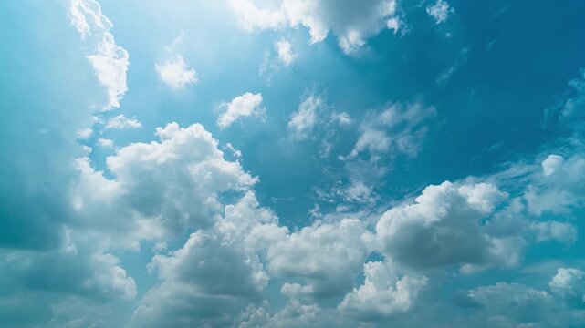 Summer Blue Sky with White Clouds Drifting Gently in a Flowing Time Lapse