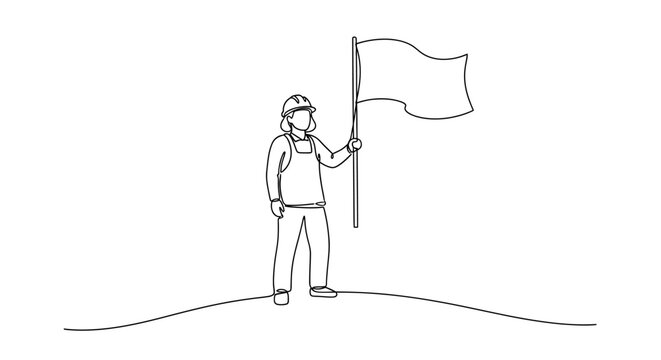 Man holding a flag on hill.