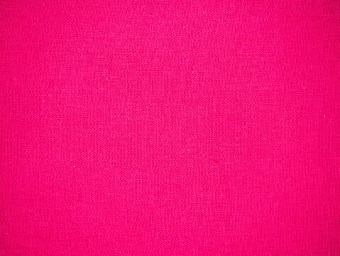 Abstract bright pink fabric texture background with fine weave pattern, full frame.