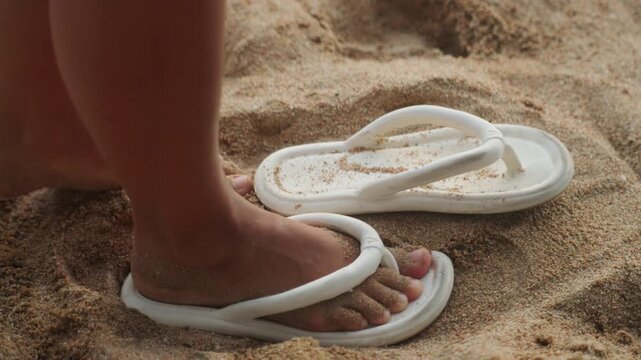 Tiny toes wiggling. Little feet in colorful shoes. Youthful toes dance in vibrant footwear nearby. Childrens tiny toes wiggle happily while wearing vivid footwear by bright shoreline