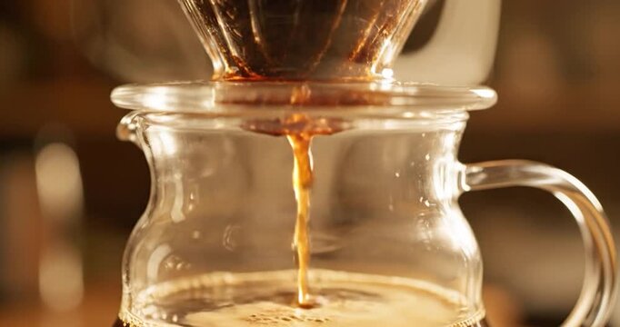 Pour Over Coffee Dripping Into Glass Carafe in a Cozy Cafe Setting