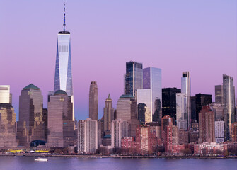Fototapeta premium New York City panorama at sunrise. Manhattan skyline at dusk. New York City skyscrapers panorama at sunset. Manhattan panoramic skyline at dusk. New York City skyline background at sunrise.
