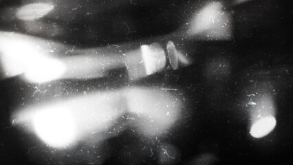 Obraz premium Old film texture with scratches, noise and light leaks. Realistic transparent overlay film texture in black-white, dust and grain. Distressed retro movie or photo negative effect of cinema nostalgia