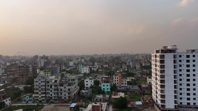 Sunrise Aerial Push In Drone Shot of Dhaka City Skyline with Golden Morning Light Bangladesh