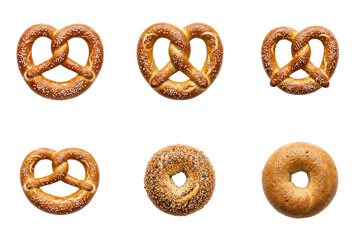 Fototapeta premium Four pretzels and two bagels, one plain and one with seeds, on clear background.