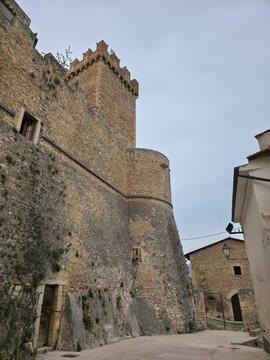 Low Angle View of the Medieval Piccolomini Castle with Imposing Stone Walls and Defensive Tower in Capestrano, Abruzzo, Italy