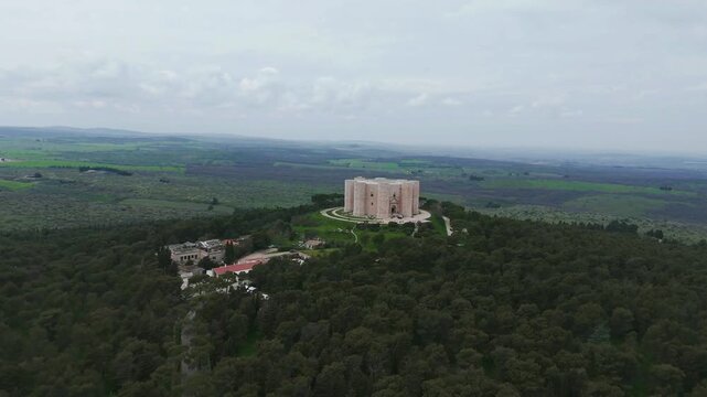 View from a drone circling around the Castel del Monte, a 13th-century citadel and castle situated on a hill in the Apulia region of southeast Italy