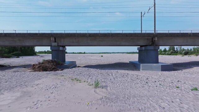 Drone shot under the bridger over dry rocky river creek