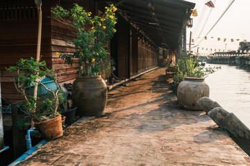 Naklejka premium he historic Amphawa canal lined with traditional Thai wooden houses and riverside shops, Bangkok, Thailand