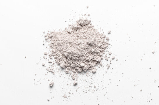 The texture of white cosmetic clay. The concept of cosmetic procedures or mud treatment.