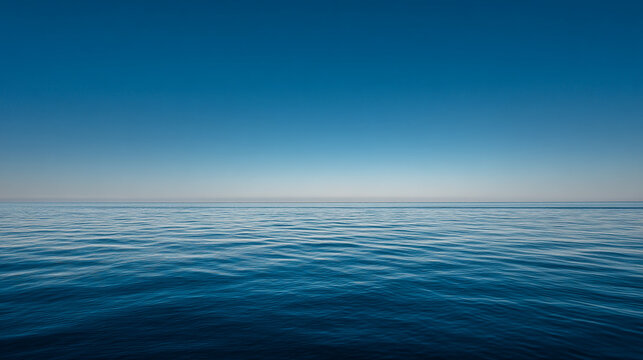 Expansive blue sky over the gentle waves of the ocean with clear sky no people water surface