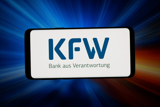 Stuttgart, Germany - 04-08-2026: In this photo illustration, the logo of company Kreditanstalt fuer Wiederaufbau (KfW) is displayed on a smartphone in front of abstract background on computer screen.