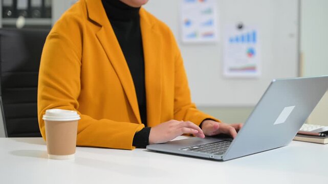 Women counting coins on calculator taking from the piggy bank. hand holding pen working on calculator to calculate on desk about cost